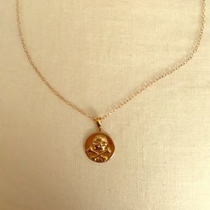 18kt gold skull necklace